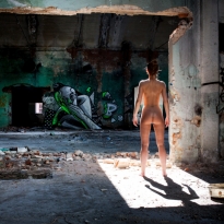 Woman in abandoned porcelain factory