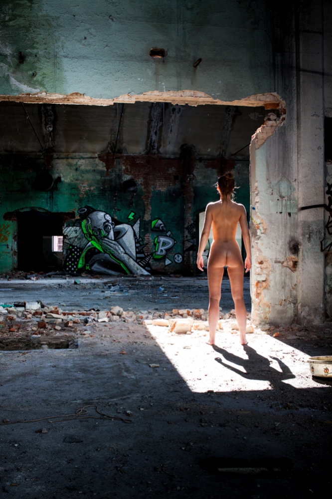 Woman in abandoned porcelain factory