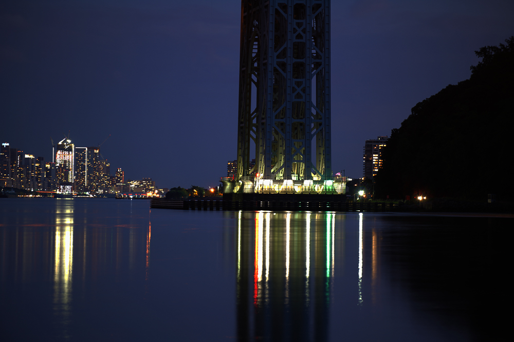 City lights through the GW Bridge at night