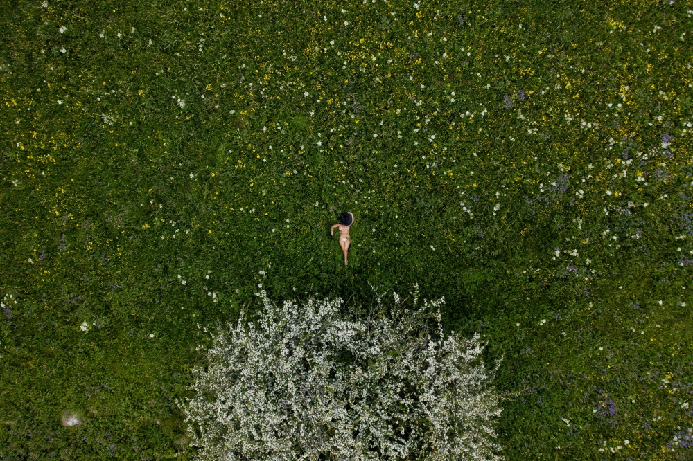 Nude in romantic spring landscape 