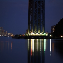 City lights through the GW Bridge at night