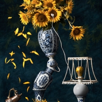 Stillife with Delft blue, sunflowers and pear