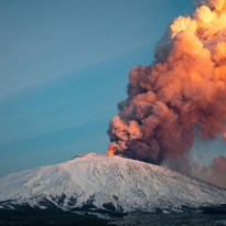 Mount Etna eruption at sunset